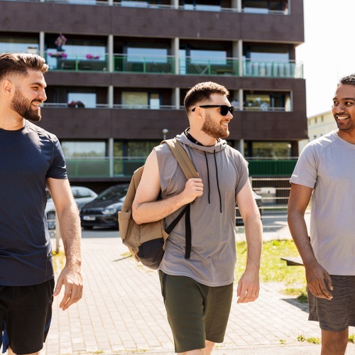 A beautiful community at the heart of all your passions three men walking down a sidewalk