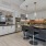 a kitchen with a bar and a bar stool