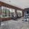 a living room with a brick wall