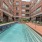 a pool in a courtyard between buildings