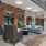 a living room with a brick wall